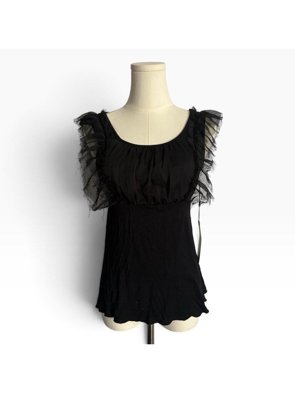 Black ruffle blouse with sheer mesh sleeves and tie back detail